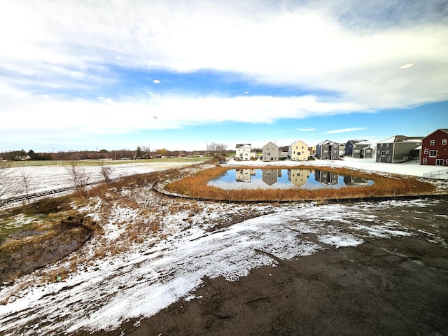 surrounding community featuring a water view