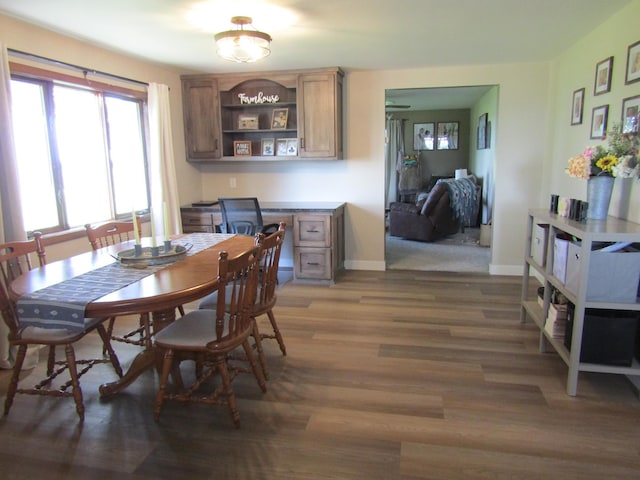 dining space with dark wood-type flooring