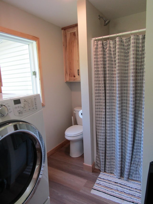 washroom featuring washer / dryer and light hardwood / wood-style floors