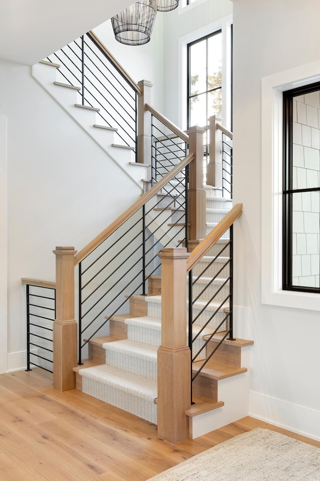 staircase featuring wood-type flooring