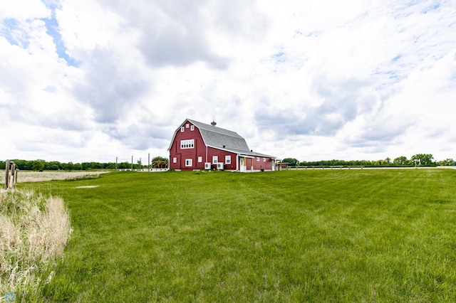 16305 57th St SE, Kindred, ND 58051 - view of grassy yard featuring a barn, an outbuilding, and a view of rural / pastoral area