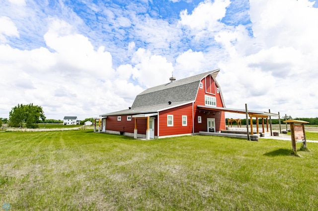 16305 57th St SE, Kindred, ND 58051 - rear view of house with a lawn and a shingled roof