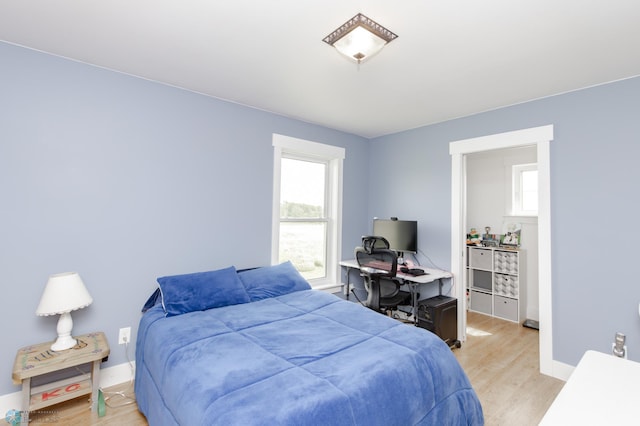 16305 57th St SE, Kindred, ND 58051 - bedroom with light wood-type flooring and baseboards