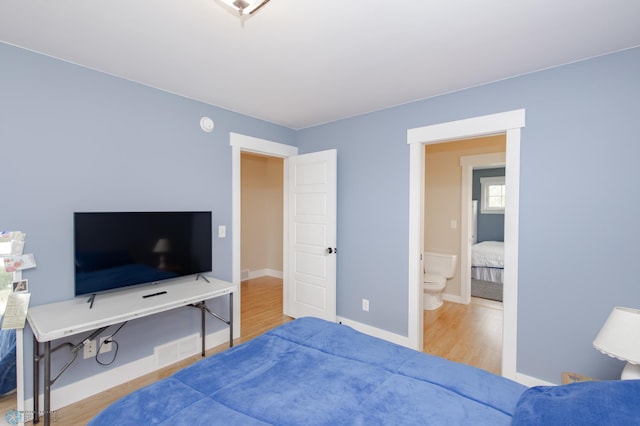 16305 57th St SE, Kindred, ND 58051 - bedroom with wood finished floors and baseboards