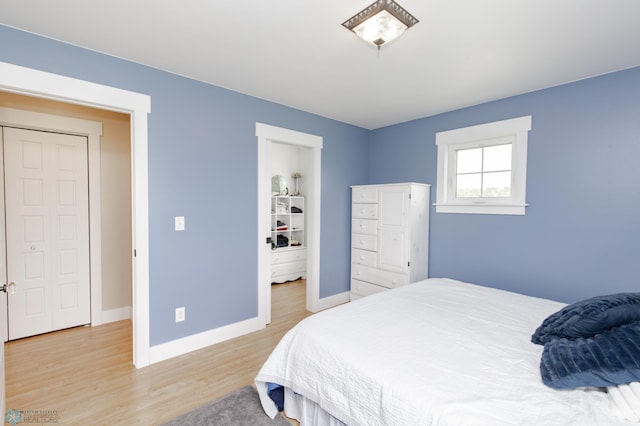 16305 57th St SE, Kindred, ND 58051 - bedroom with light wood-style floors and baseboards