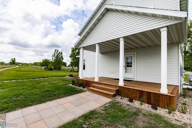 16305 57th St SE, Kindred, ND 58051 - property entrance featuring covered porch and a lawn