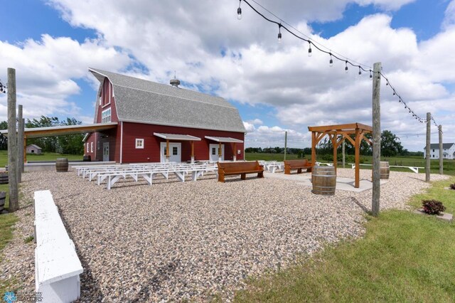 16305 57th St SE, Kindred, ND 58051 - rear view of house featuring a shingled roof