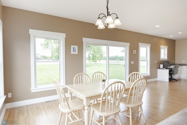 16305 57th St SE, Kindred, ND 58051 - dining space featuring light wood-style floors, a chandelier, plenty of natural light, baseboards, and recessed lighting