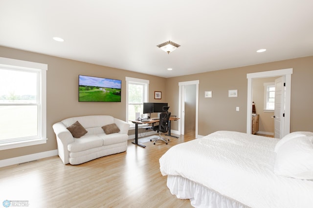16305 57th St SE, Kindred, ND 58051 - bedroom featuring an office area, baseboards, light wood-style floors, and recessed lighting