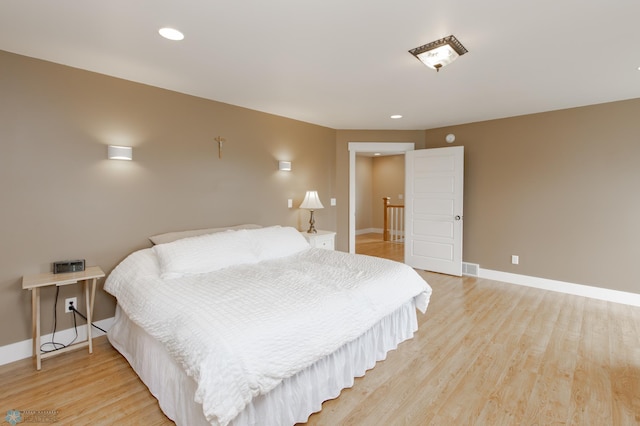 16305 57th St SE, Kindred, ND 58051 - bedroom with light wood finished floors, baseboards, and recessed lighting