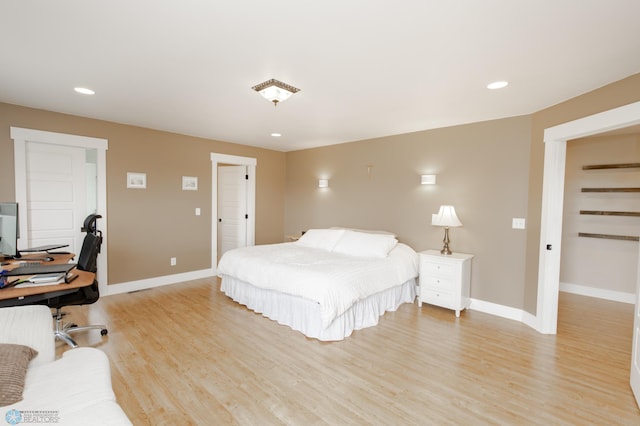 16305 57th St SE, Kindred, ND 58051 - bedroom featuring baseboards, light wood-style flooring, recessed lighting, and a desk