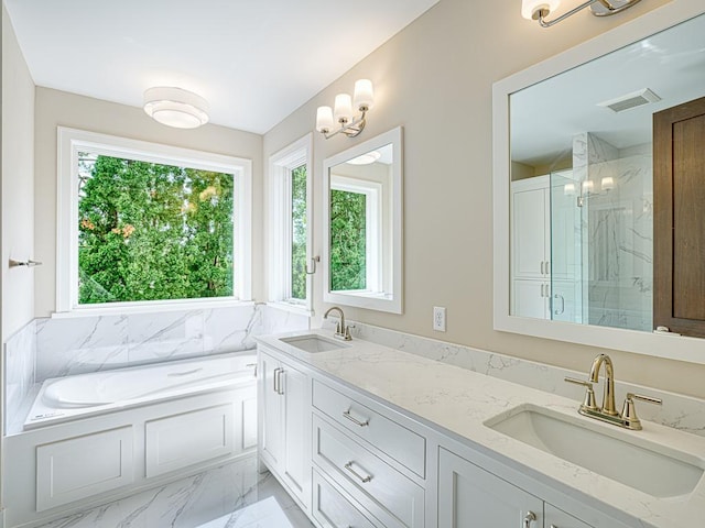 full bath featuring a marble finish shower, marble finish floor, visible vents, and a sink