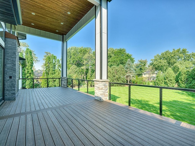 wooden deck with a lawn