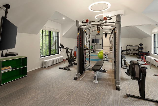 exercise area with carpet flooring and radiator