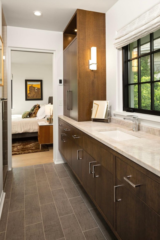 bathroom featuring hardwood / wood-style flooring and vanity