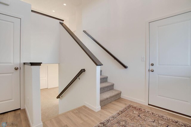 3843 19th St S, Moorhead, MN 56560 - staircase featuring wood finished floors, baseboards, and recessed lighting