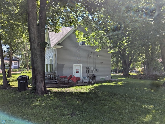 view of property exterior with a yard