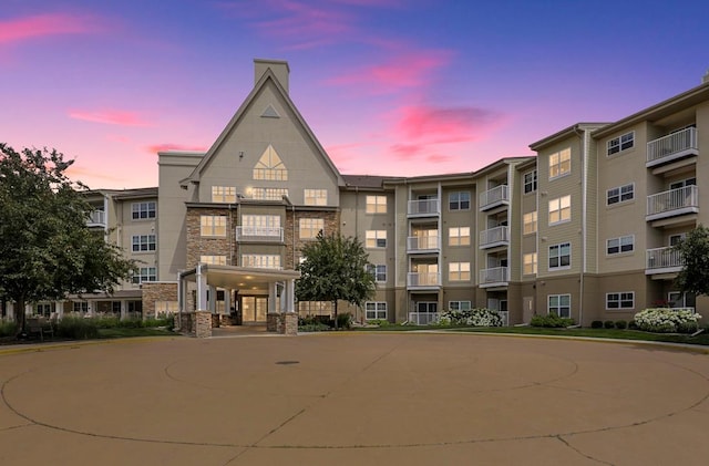 view of outdoor building at dusk