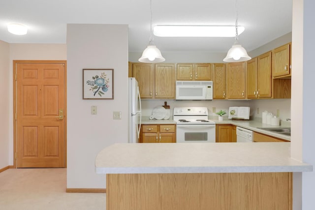 kitchen with pendant lighting, light colored carpet, kitchen peninsula, and white appliances