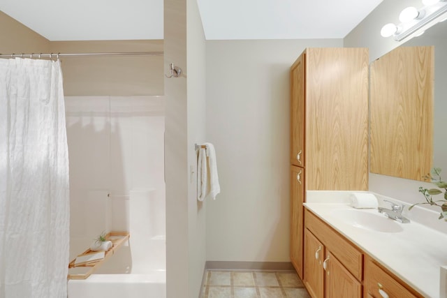 bathroom featuring shower / tub combo and vanity