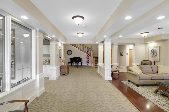 interior space with hardwood / wood-style flooring and ornate columns