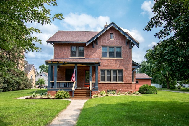 view of front of home featuring a front yard and a porch