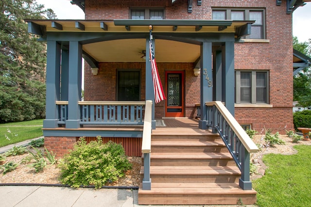 view of exterior entry with covered porch