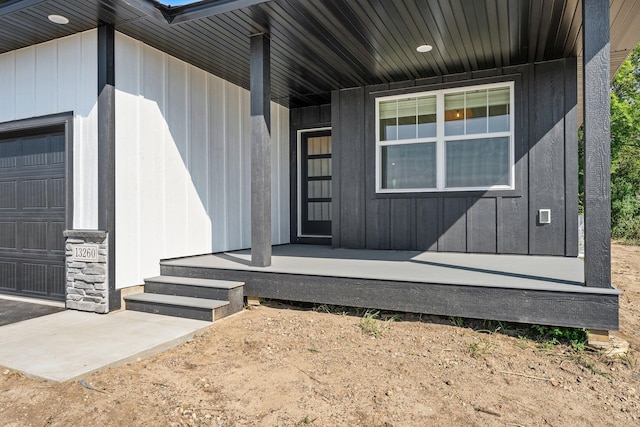 view of exterior entry with a garage