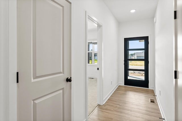 entryway with light hardwood / wood-style floors