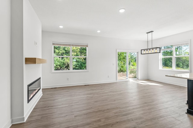 unfurnished living room featuring dark wood-type flooring