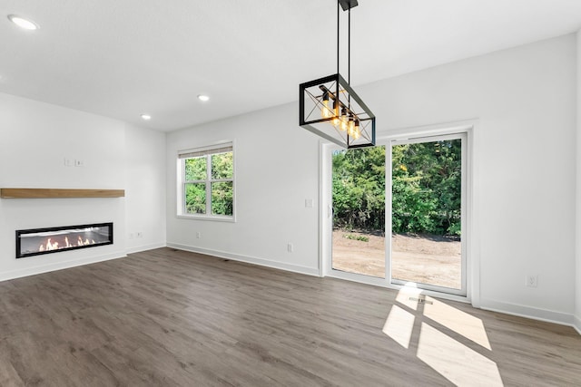 unfurnished living room with dark wood-type flooring