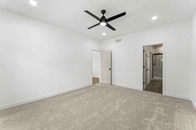 unfurnished bedroom with carpet, ceiling fan, and ensuite bathroom