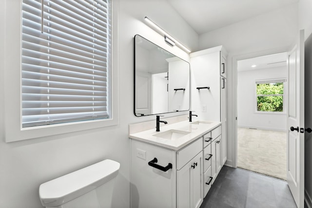 bathroom with vanity and toilet