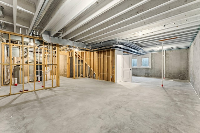 basement featuring electric water heater