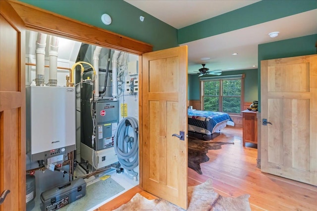 utility room with water heater