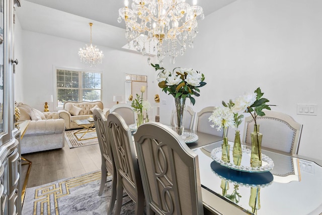 dining room featuring dark hardwood / wood-style floors and a chandelier