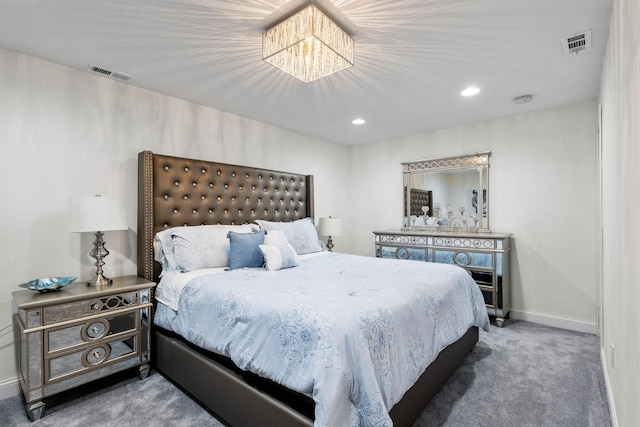 bedroom with carpet and a chandelier