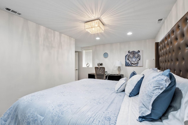 bedroom with a notable chandelier