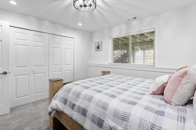 carpeted bedroom featuring a closet