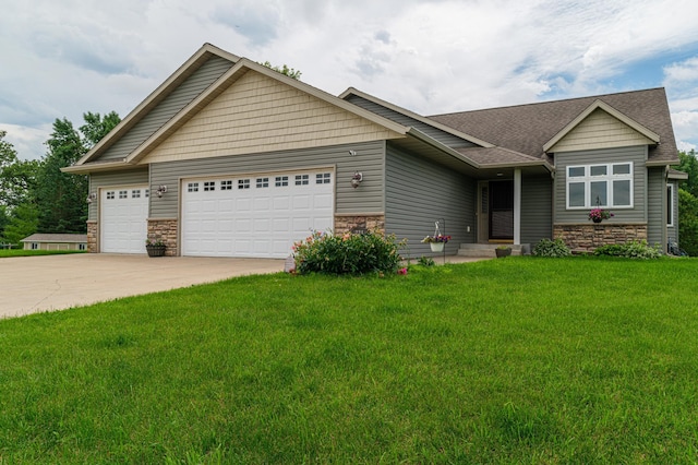 view of front of house with a front lawn and a garage