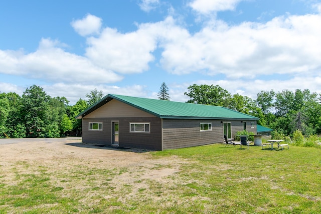 view of property exterior with a yard