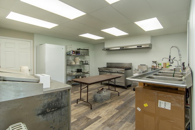 office space featuring sink, dark wood-type flooring, and a paneled ceiling