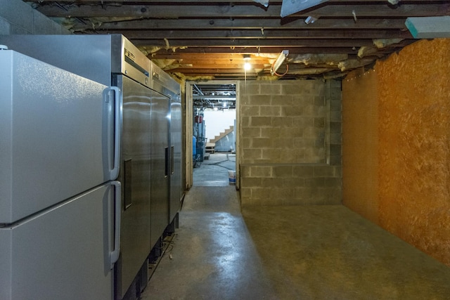 basement with white fridge