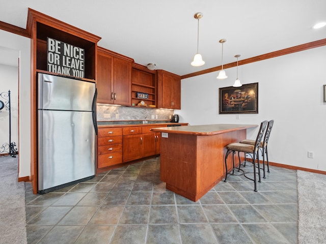 1599 Donway Ct NE, Alexandria, MN 56308 - kitchen with freestanding refrigerator, open shelves, brown cabinetry, decorative backsplash, and crown molding