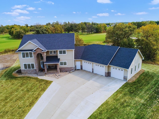 1599 Donway Ct NE, Alexandria, MN 56308 - traditional-style home featuring stone siding, a garage, a front lawn, driveway, and a porch