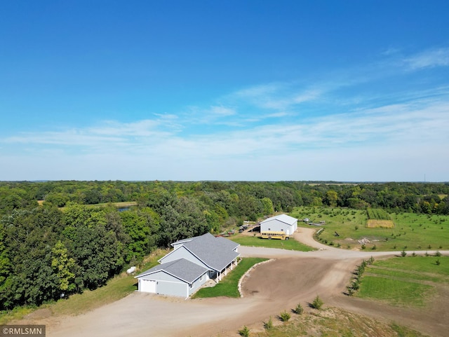 bird's eye view featuring a forest view