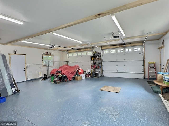 garage featuring a garage door opener