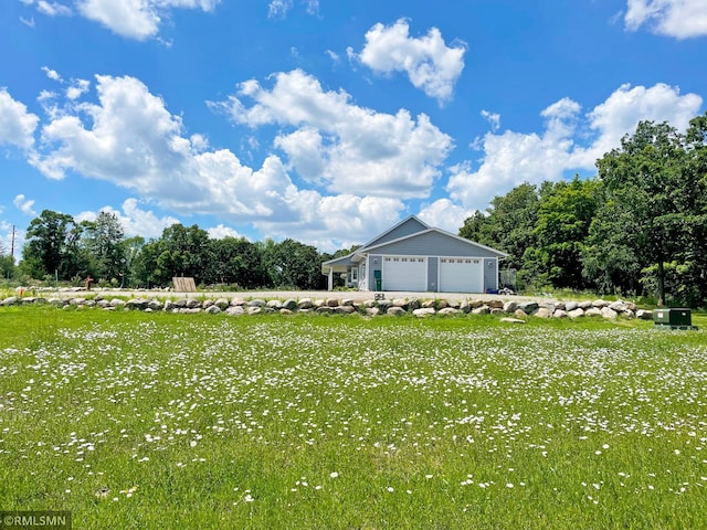 view of yard featuring a garage