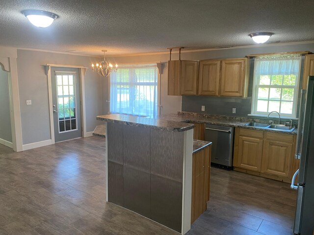 kitchen with a notable chandelier, dark hardwood / wood-style flooring, appliances with stainless steel finishes, decorative light fixtures, and sink