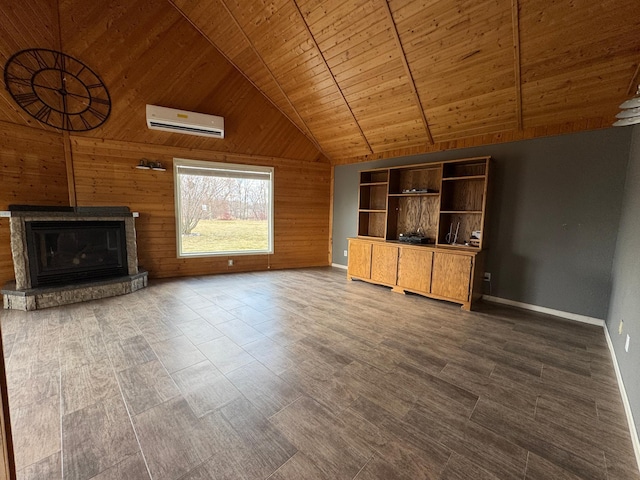 unfurnished living room with a wall mounted air conditioner, a glass covered fireplace, wood walls, wood ceiling, and lofted ceiling